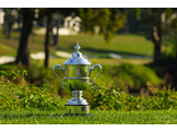 U.S. Women's Open golf trophy shown on a golf course.